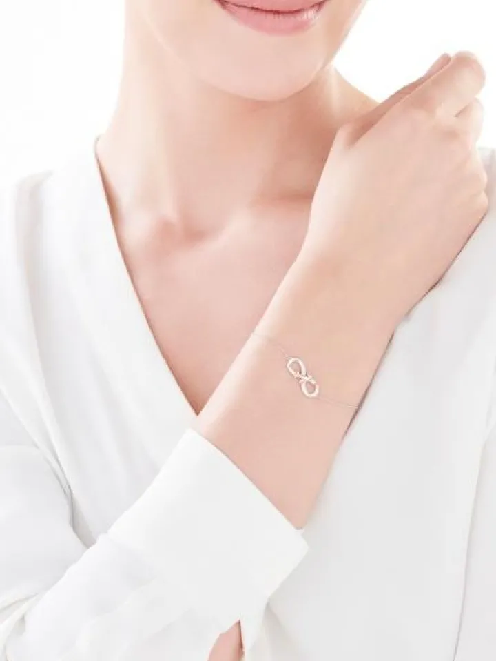 Bransoletka z białego i różowego złota z diamentami - róża, nieskończoność - 0,06 ct - próba 375