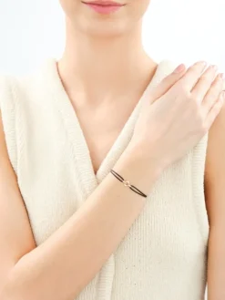 Bransoletka z cyrkoniami i elementami z żółtego złota