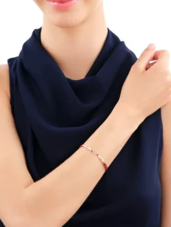 Bransoletka z diamentem, perłami i elementami  żółtego złota - serce - próba 375