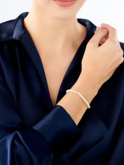 Bransoletka z elementami z białego złota - perły