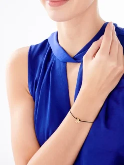 Bransoletka z elementami srebra - litera A, koniczyna