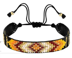 Bransoletka z elementami z żółtego złota i koralikami