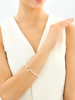 Bransoletka z elementami z żółtego złota - perły