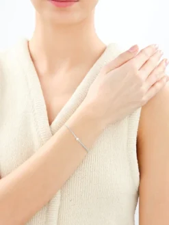 Bransoletka z perłą, cyrkoniami i elementami z żółtego złota