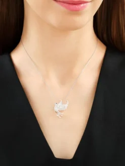 Broszka - zawieszka z białego złota z brylantami i szafirem - ptak - próba 750