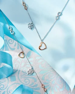 Naszyjnik z białego i różowego złota z diamentami - serce, nieskończoność, koniczyna - 0,01 ct - próba 375