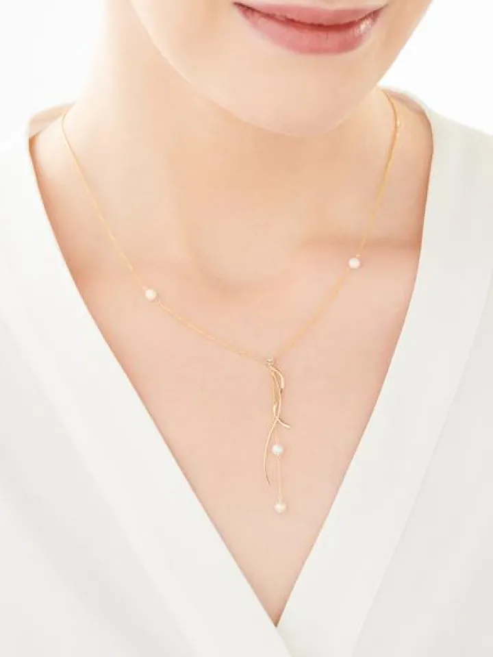 Naszyjnik z żółtego i białego złota z brylantem i perłami - próba 585