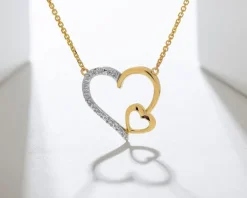 Naszyjnik z żółtego złota z diamentami - serca - 0,01 ct - próba 375