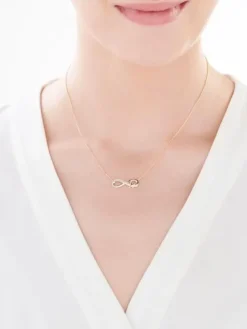 Naszyjnik z żółtego złota z diamentami - nieskończoność, litera K - 0,01 ct - próba 375
