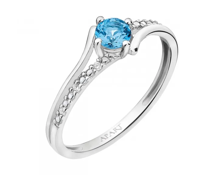 Pierścionek z białego złota z brylantami i topazem - próba 375