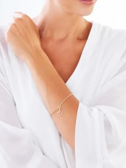 Zawieszka charms z żółtego złota z diamentami - serca - 0,01 ct - próba 375