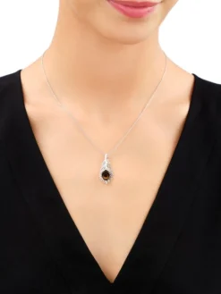 Zawieszka srebrna z bursztynem - piórko