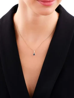 Zawieszka z  żółtego i białego złota z diamentami i szafirem - próba 585