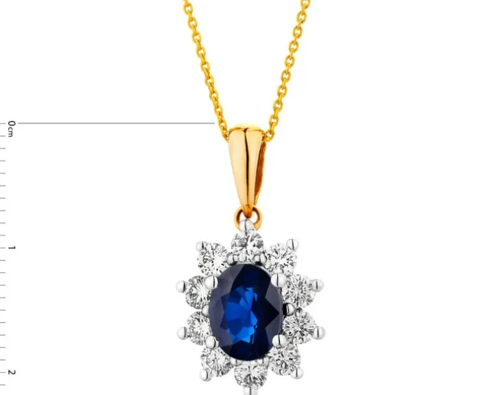 Zawieszka z żółtego i białego złota z brylantami i szafirem - próba 585
