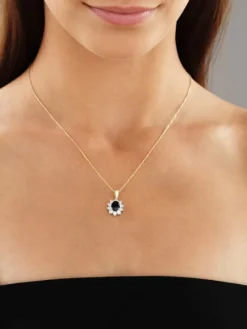 Zawieszka z żółtego i białego złota z brylantami i szafirem - próba 585