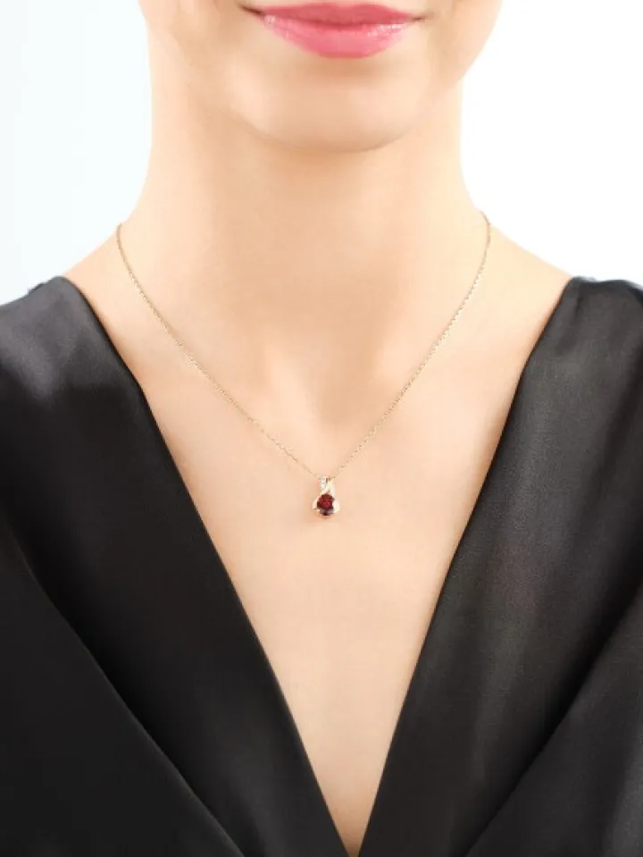 Zawieszka z żółtego złota diamentami i granatem - próba 585