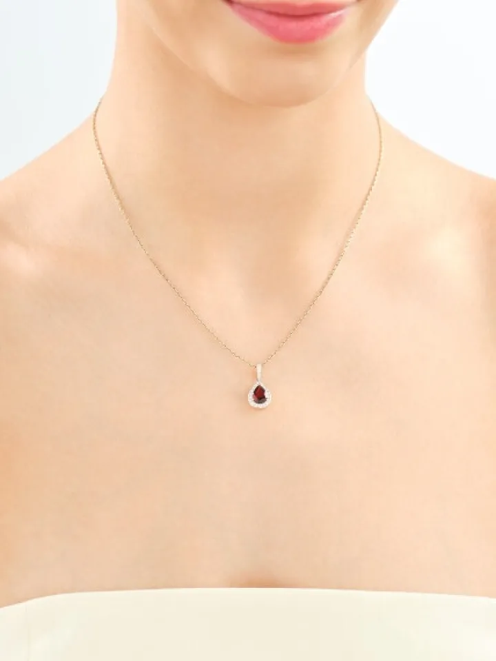 Zawieszka z żółtego złota z brylantami i granatem - próba 585