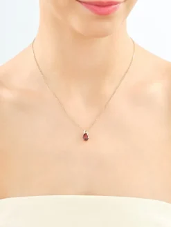 Zawieszka z żółtego złota z brylantami i granatem - próba 585