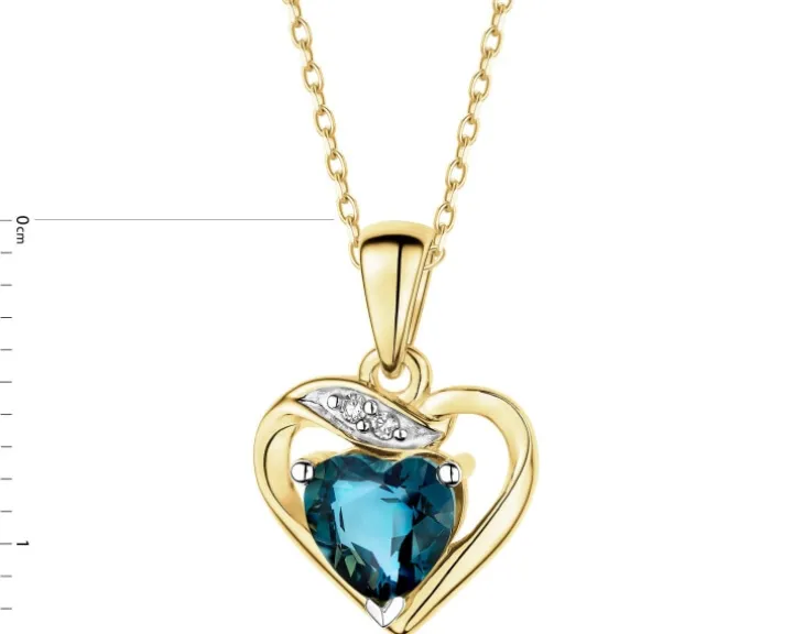 Zawieszka z żółtego złota z diamentami i topazem London Blue - serce - próba 375