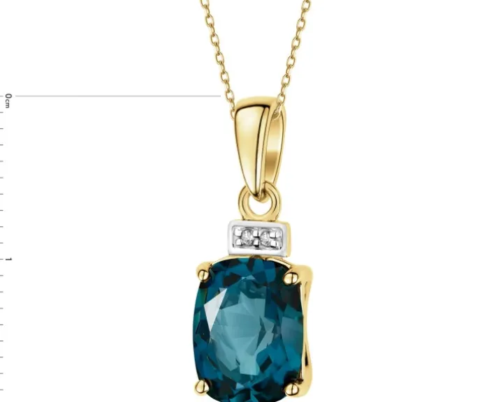 Zawieszka z żółtego złota z diamentami i topazem London Blue - próba 585