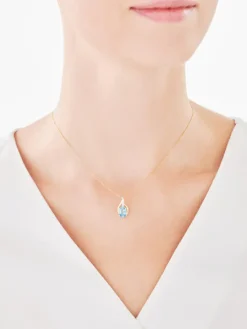 Zawieszka z żółtego złota z diamentami i topazem - próba 375