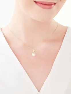 Zawieszka z żółtego złota z diamentami i perłą - próba 585