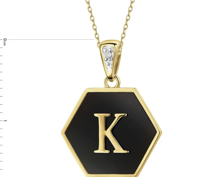 Zawieszka z żółtego złota z diamentem i onyksem - litera K - próba 375