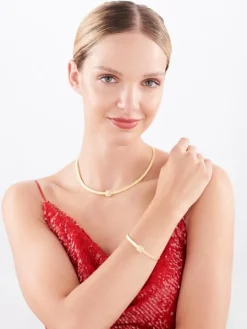 Złota bransoletka sztywna z cyrkoniami