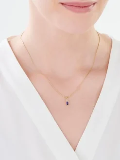 Złota zawieszka z szafirem syntetycznym i cyrkonią